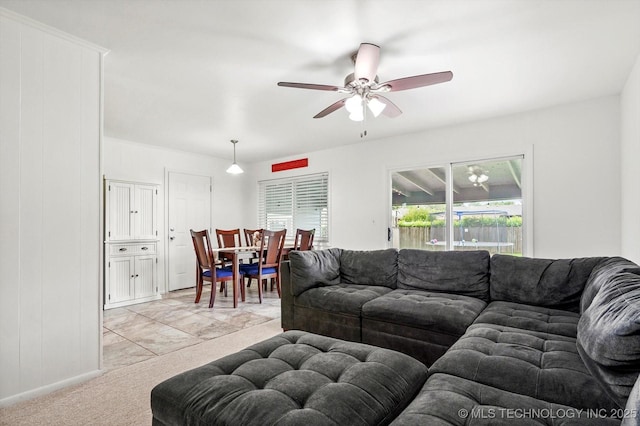 7547 E 27th St, Tulsa, OK 74129 - living area featuring ceiling fan and light carpet