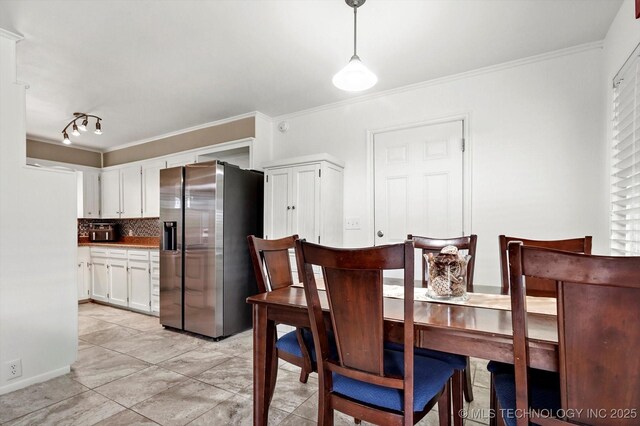 7547 E 27th St, Tulsa, OK 74129 - dining area featuring ornamental molding