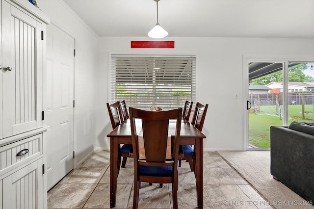 7547 E 27th St, Tulsa, OK 74129 - dining area featuring baseboards