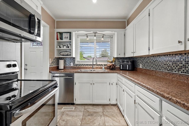 7547 E 27th St, Tulsa, OK 74129 - kitchen featuring appliances with stainless steel finishes, white cabinetry, dark countertops, tasteful backsplash, and crown molding