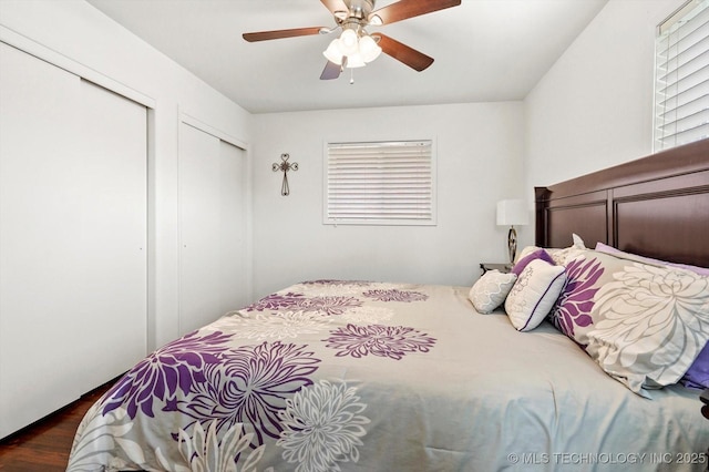 7547 E 27th St, Tulsa, OK 74129 - bedroom featuring multiple closets, ceiling fan, and dark wood finished floors