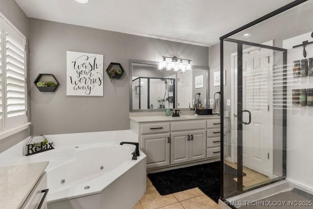 1516 W Trenton St, Broken Arrow, OK 74012 - bathroom with vanity, a shower stall, a tub with jets, and tile patterned floors