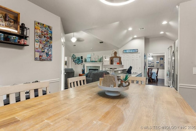 1516 W Trenton St, Broken Arrow, OK 74012 - dining space featuring wood finished floors, a fireplace, lofted ceiling, and recessed lighting