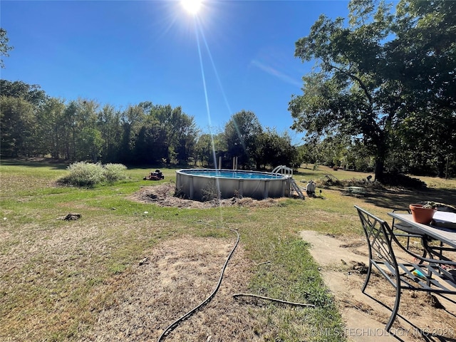 3176 E 2030th Rd, Sawyer, OK 74756 - view of grassy yard with an outdoor pool