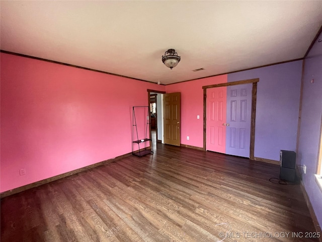 3176 E 2030th Rd, Sawyer, OK 74756 - unfurnished bedroom featuring wood finished floors and ornamental molding
