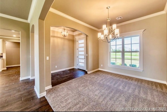 9022 N 65th Pl E, Owasso, OK 74055 - empty room featuring a chandelier, arched walkways, ornamental molding, dark wood-type flooring, and dark colored carpet
