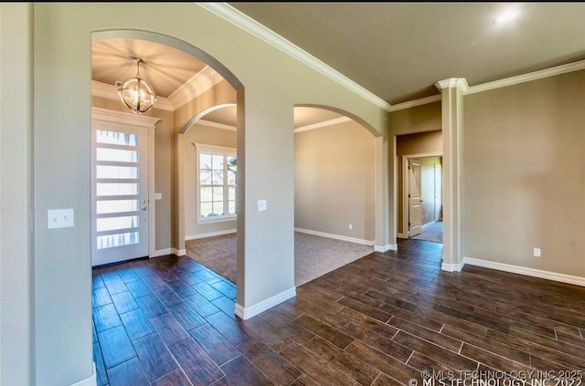 9022 N 65th Pl E, Owasso, OK 74055 - foyer featuring wood tiled floors, arched walkways, a chandelier, and ornamental molding
