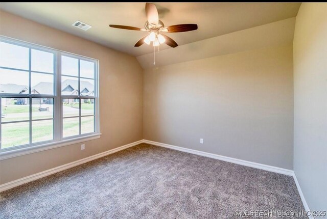 9022 N 65th Pl E, Owasso, OK 74055 - carpeted spare room featuring ceiling fan and baseboards