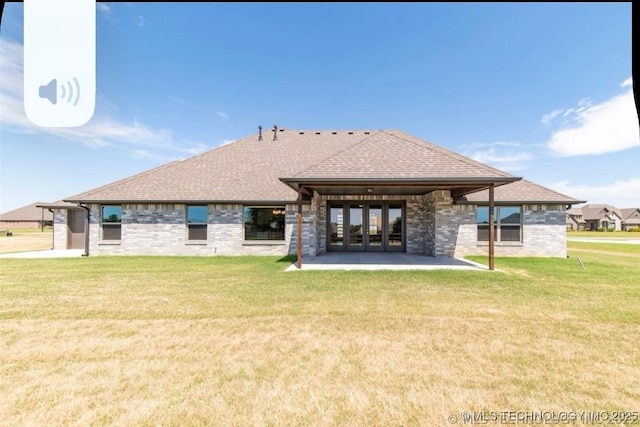 9022 N 65th Pl E, Owasso, OK 74055 - rear view of house featuring a patio area, a lawn, french doors, and brick siding