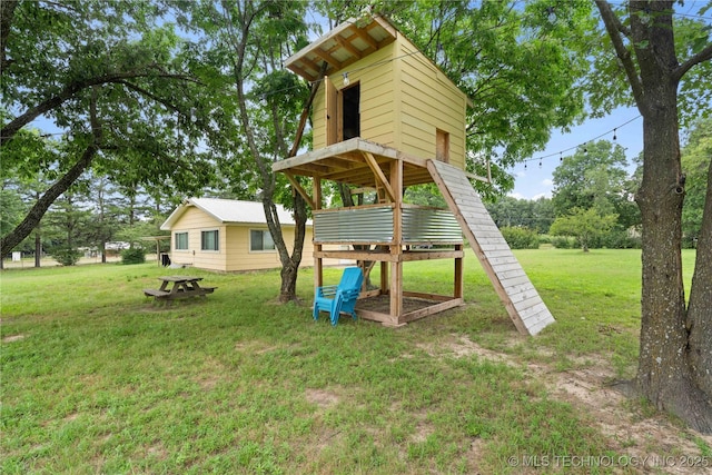 417530 E 1140th Rd, Checotah, OK 74426 - view of play area with a lawn