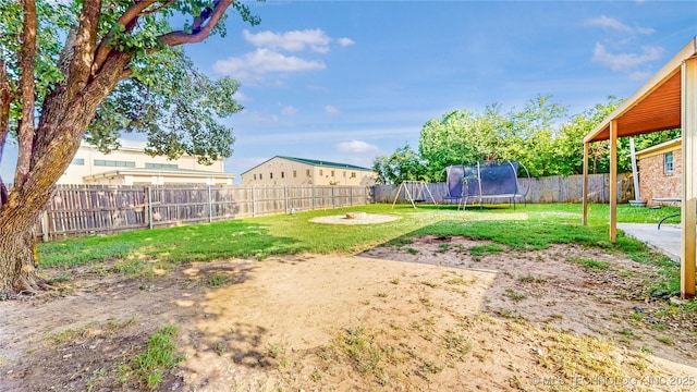 5605 S 95th E Ave, Tulsa, OK 74145 - fenced backyard featuring a trampoline