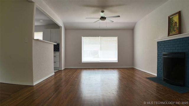 5921 S Sandusky Ave, Tulsa, OK 74135 - unfurnished living room with a ceiling fan, wood finished floors, and a fireplace