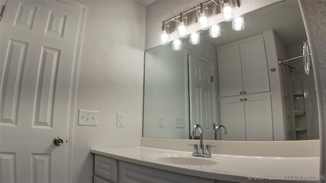 5921 S Sandusky Ave, Tulsa, OK 74135 - bathroom featuring vanity and a shower