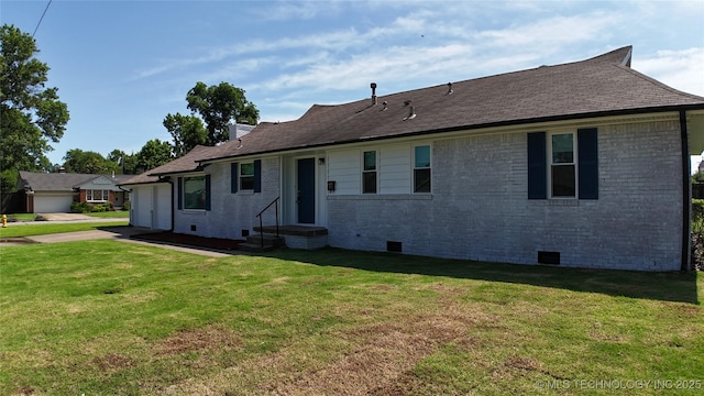5921 S Sandusky Ave, Tulsa, OK 74135 - rear view of property featuring crawl space, a lawn, brick siding, and a garage