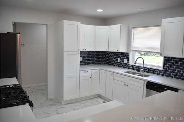 5921 S Sandusky Ave, Tulsa, OK 74135 - kitchen with stainless steel appliances, light marble finish floors, light countertops, white cabinetry, and recessed lighting