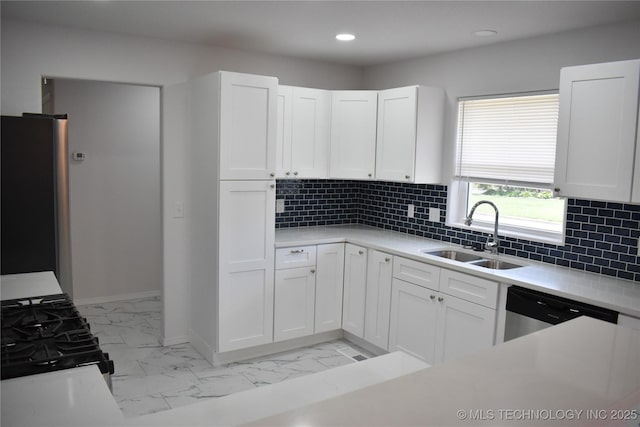 5921 S Sandusky Ave, Tulsa, OK 74135 - kitchen with light marble finish flooring, stainless steel appliances, white cabinetry, light countertops, and recessed lighting