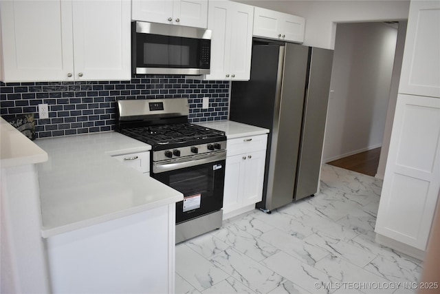 5921 S Sandusky Ave, Tulsa, OK 74135 - kitchen featuring stainless steel appliances, light marble finish floors, white cabinetry, and decorative backsplash