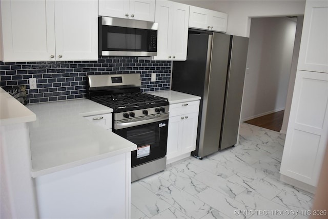 5921 S Sandusky Ave, Tulsa, OK 74135 - kitchen with appliances with stainless steel finishes, light marble finish floors, white cabinets, and light countertops