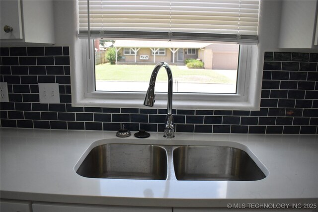 5921 S Sandusky Ave, Tulsa, OK 74135 - kitchen view of decorative backsplash and light countertops