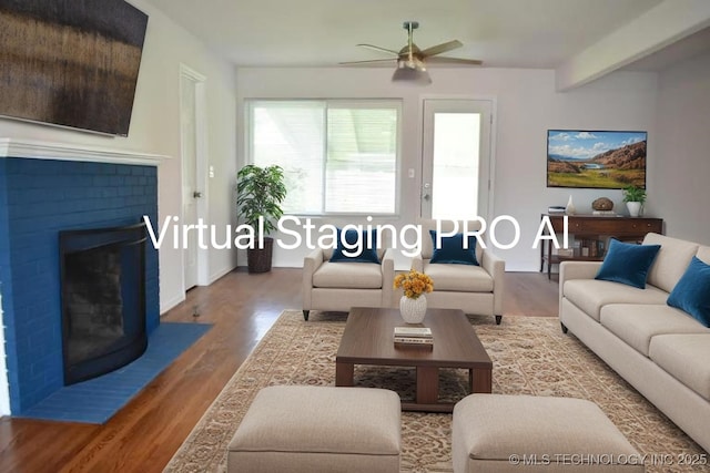 5921 S Sandusky Ave, Tulsa, OK 74135 - living room with wood finished floors, a ceiling fan, and a fireplace