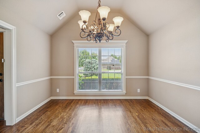 9200 E 92nd Pl, Owasso, OK 74055 - spare room with a chandelier, vaulted ceiling, and wood finished floors
