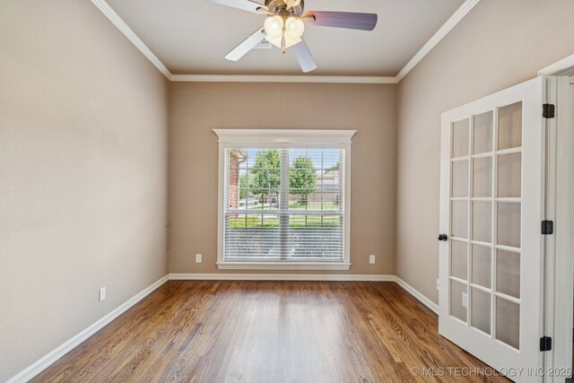 9200 E 92nd Pl, Owasso, OK 74055 - spare room featuring ornamental molding, wood finished floors, and a ceiling fan