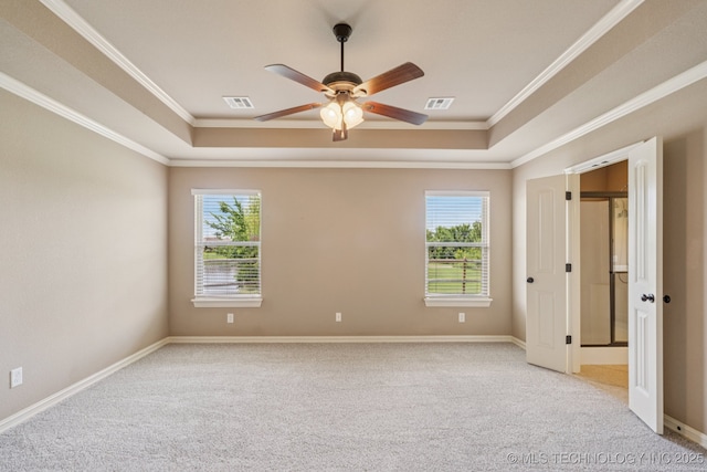9200 E 92nd Pl, Owasso, OK 74055 - unfurnished bedroom with a raised ceiling, multiple windows, crown molding, and light colored carpet