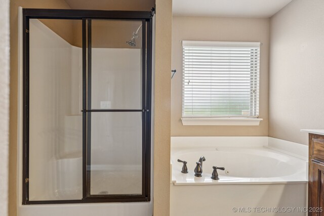 9200 E 92nd Pl, Owasso, OK 74055 - bathroom with a bath, a shower stall, and vanity