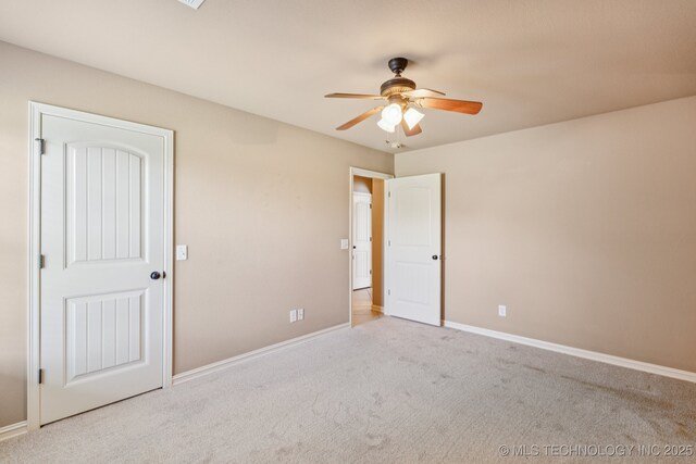 9200 E 92nd Pl, Owasso, OK 74055 - unfurnished bedroom featuring carpet floors and a ceiling fan
