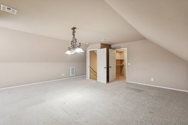 9200 E 92nd Pl, Owasso, OK 74055 - additional living space featuring lofted ceiling and light colored carpet