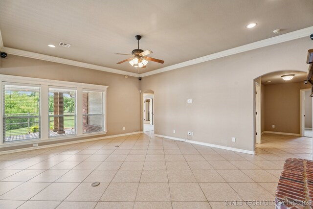 9200 E 92nd Pl, Owasso, OK 74055 - empty room with arched walkways, ceiling fan, ornamental molding, a smoke detector, and light tile patterned flooring