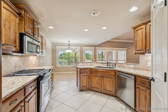 9200 E 92nd Pl, Owasso, OK 74055 - kitchen featuring stainless steel appliances, a peninsula, backsplash, ornamental molding, and light stone counters