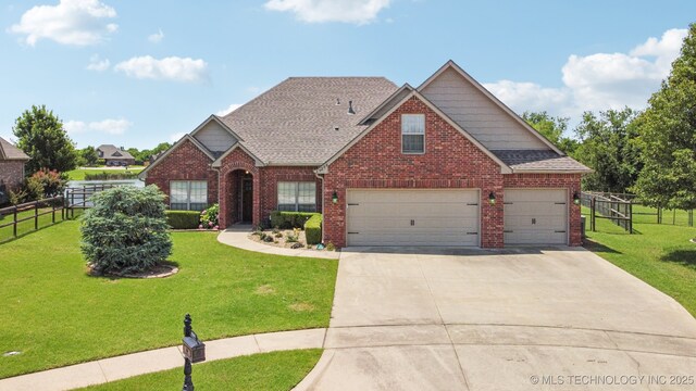 9200 E 92nd Pl, Owasso, OK 74055 - traditional-style house featuring brick siding, driveway, and roof with shingles