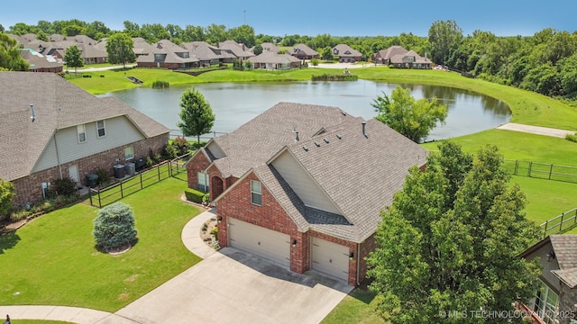 9200 E 92nd Pl, Owasso, OK 74055 - aerial perspective of suburban area with a nearby body of water
