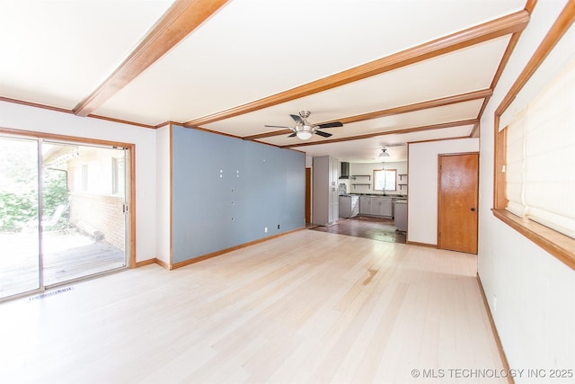 7025 E 58th Pl, Tulsa, OK 74145 - unfurnished living room featuring beamed ceiling, a ceiling fan, and light wood-type flooring
