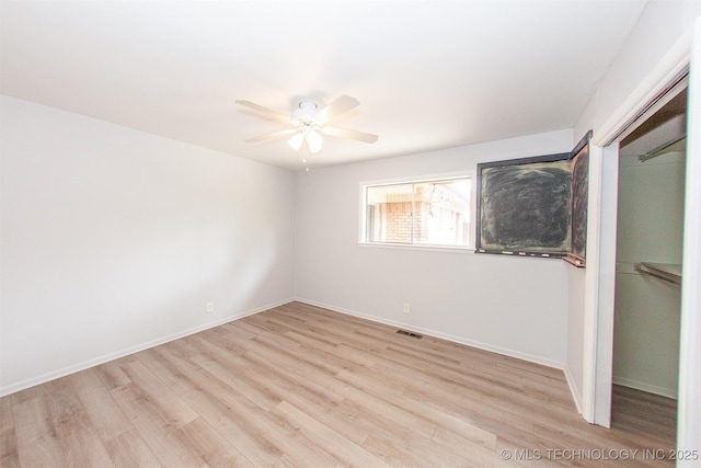 7025 E 58th Pl, Tulsa, OK 74145 - unfurnished bedroom with light wood-style floors, a closet, and ceiling fan