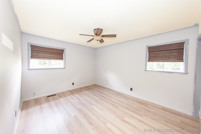 7025 E 58th Pl, Tulsa, OK 74145 - spare room featuring healthy amount of natural light, light wood finished floors, and a ceiling fan