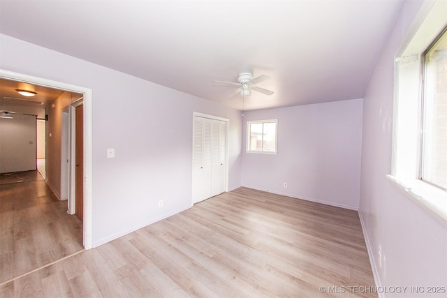 7025 E 58th Pl, Tulsa, OK 74145 - unfurnished bedroom featuring light wood-style flooring, a closet, and ceiling fan