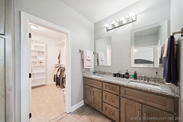 1909 W Nashville St, Broken Arrow, OK 74012 - bathroom with double vanity and a walk in closet
