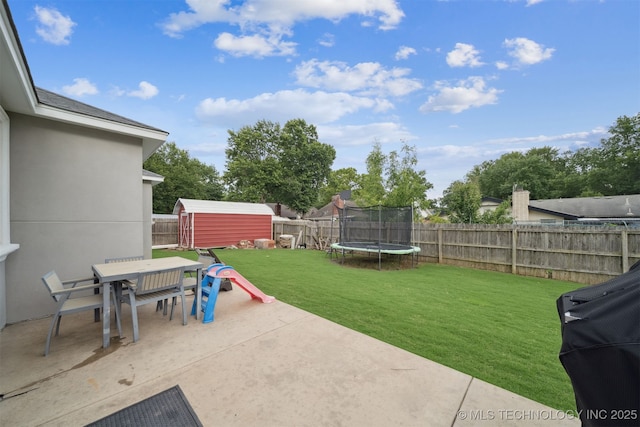 1909 W Nashville St, Broken Arrow, OK 74012 - fenced backyard with a patio, outdoor dining space, a shed, and a trampoline