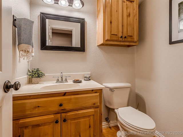 333 Springview Dr, Skiatook, OK 74070 - half bathroom featuring vanity and toilet