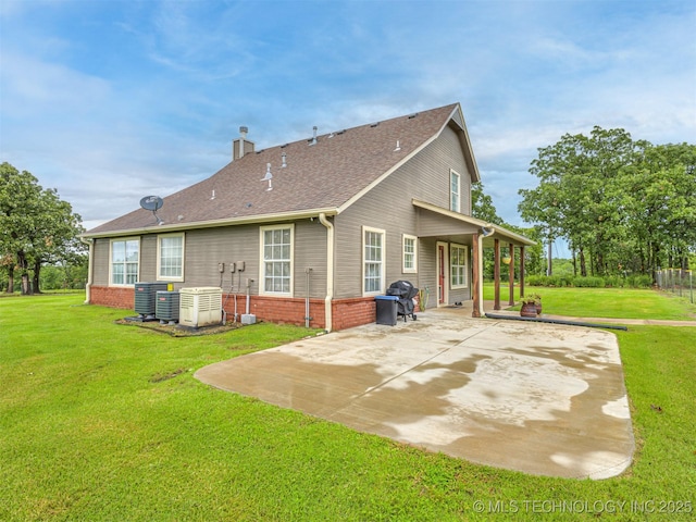 333 Springview Dr, Skiatook, OK 74070 - back of house featuring a patio, a chimney, a lawn, a shingled roof, and brick siding