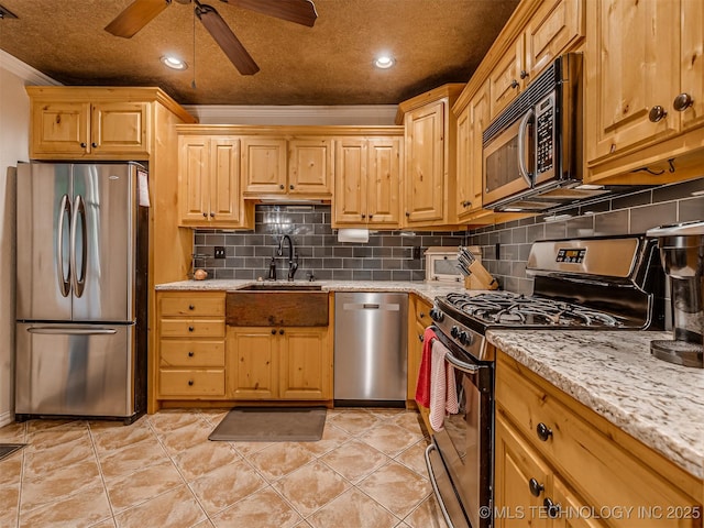 333 Springview Dr, Skiatook, OK 74070 - kitchen featuring stainless steel appliances, crown molding, a ceiling fan, backsplash, and light stone counters
