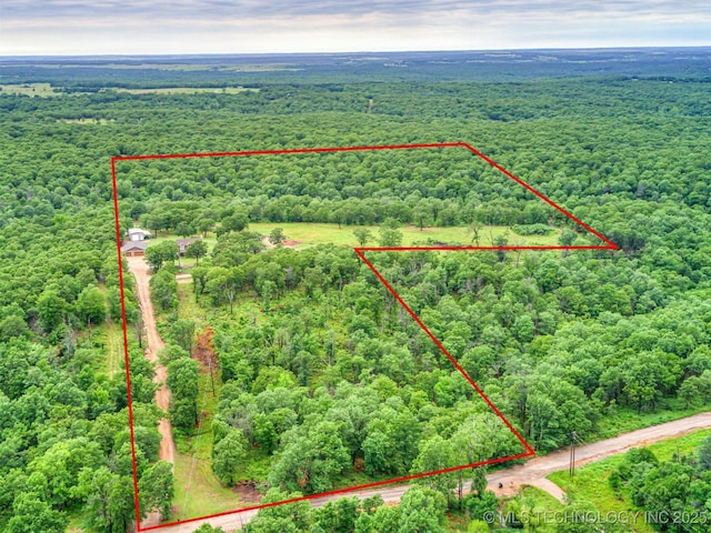 333 Springview Dr, Skiatook, OK 74070 - aerial view of property and surrounding area with a forest and property parcel outlined