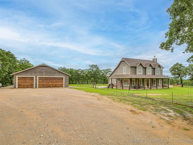 333 Springview Dr, Skiatook, OK 74070 - farmhouse inspired home featuring a garage, a porch, a chimney, an outbuilding, and driveway