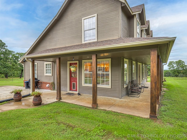 333 Springview Dr, Skiatook, OK 74070 - view of front of home with a front lawn, a porch, and a shingled roof