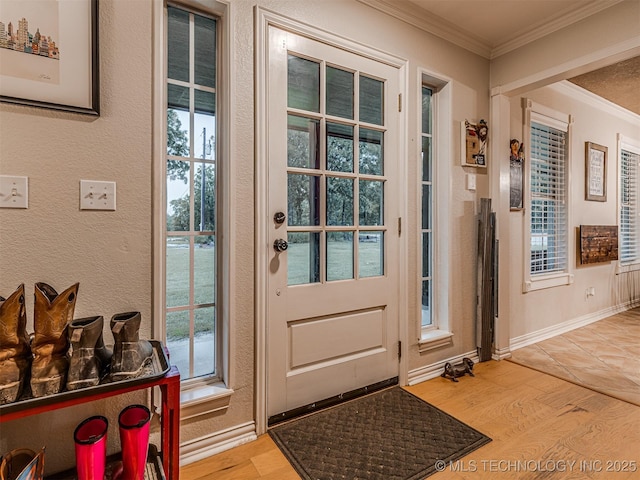 333 Springview Dr, Skiatook, OK 74070 - doorway to outside featuring ornamental molding and light wood-style flooring
