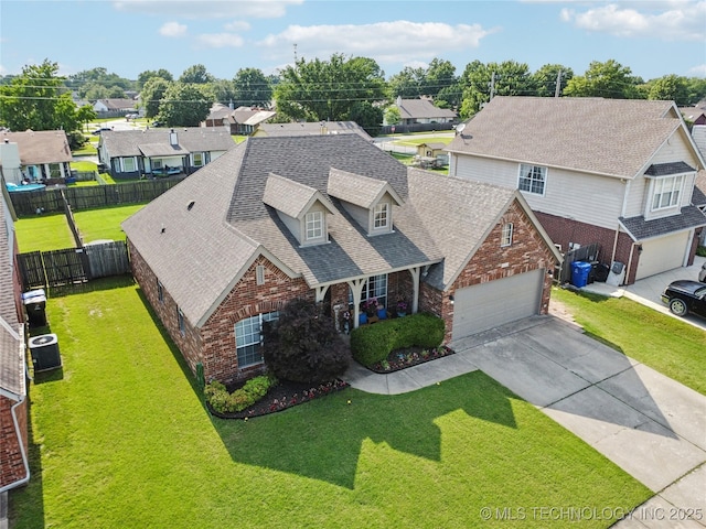 1112 N Yellowood Ave, Broken Arrow, OK 74012 - view of front facade featuring brick siding, concrete driveway, a shingled roof, and a residential view