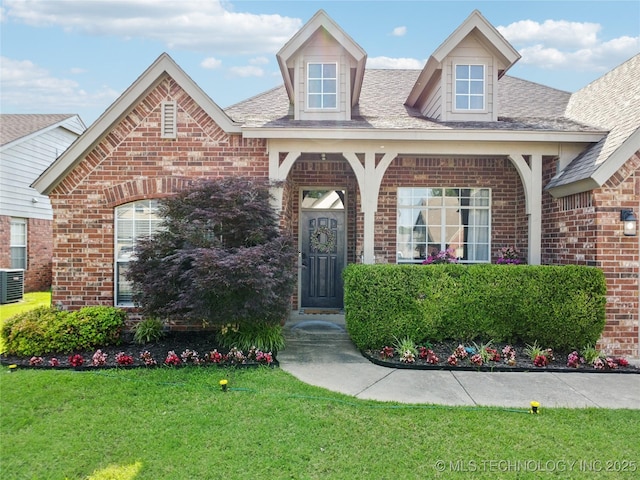 1112 N Yellowood Ave, Broken Arrow, OK 74012 - view of front of property featuring brick siding, a front yard, and a shingled roof