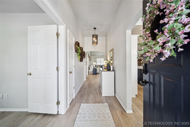 1112 N Yellowood Ave, Broken Arrow, OK 74012 - entrance foyer featuring light wood finished floors and arched walkways